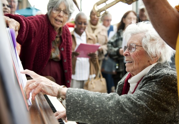 Group leader of the Music Makers Donna Hewitt plays the piano outside of Sidetrack Bar and Grill in Ypsilanti on Tuesday. Pianos 'Round Town can be experienced on the sidewalks of Depot Town and downtown Ypsilanti. Daniel Brenner I AnnArbor.com